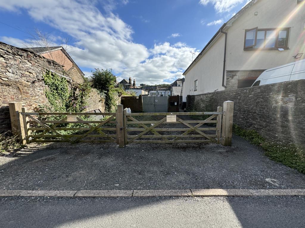 Lot: 41 - LAND WITH POTENTIAL - View of the land from the wooden gates